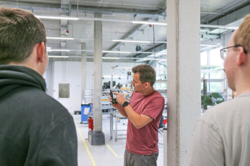 Production manager Finn Krüger points to a device in his hand