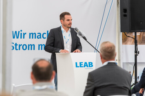 Richard Westerkamp stands at a lectern with a microphone