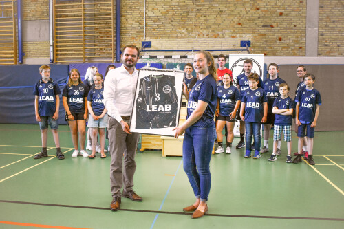 Richard Westerkamp presents a framed jersey