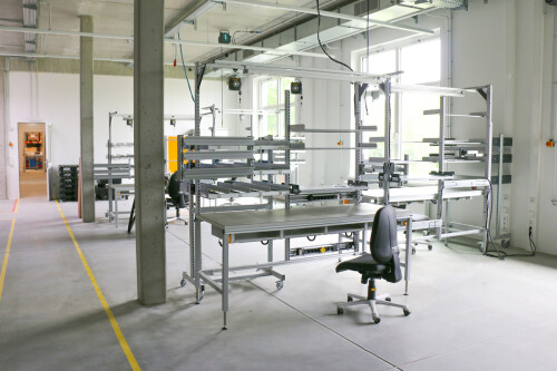 Production facility in the new Busdorf building with tables and a chair